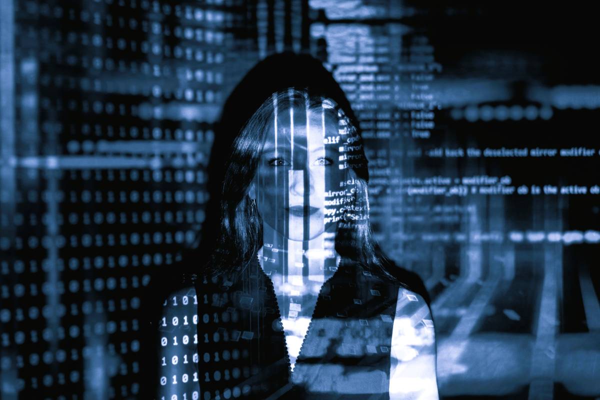 Woman with digital code overlay for Vedo Group workforce technology.